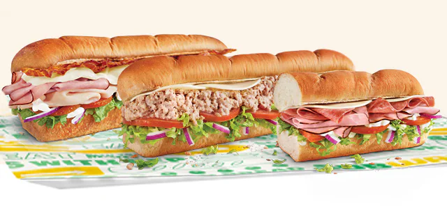 Promotional Subway® email showing an in‑restaurant offer for twenty percent off a sub. A QR code is in the center, with images of three  subs below. Text notes the deal is available in restaurant only and requires scanning the QR code to redeem.
