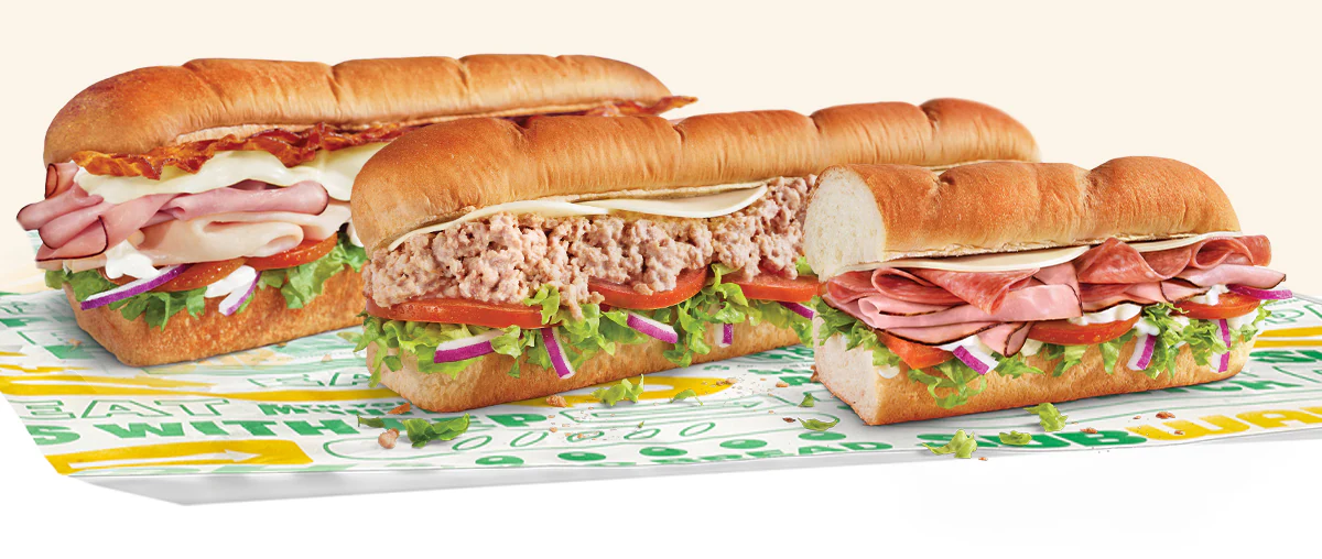 Promotional Subway® email showing an in‑restaurant offer for twenty percent off a sub. A QR code is in the center, with images of three  subs below. Text notes the deal is available in restaurant only and requires scanning the QR code to redeem.