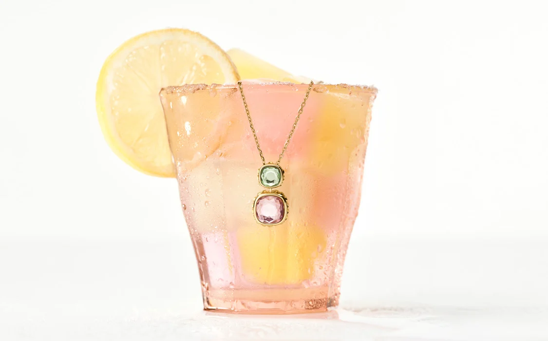 Swarovski Chroma pendant hanging from glass