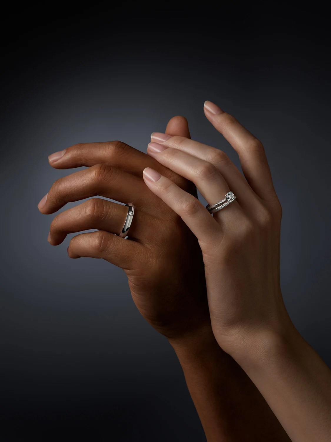 Two hands wearing Swarovski Created Diamonds rings