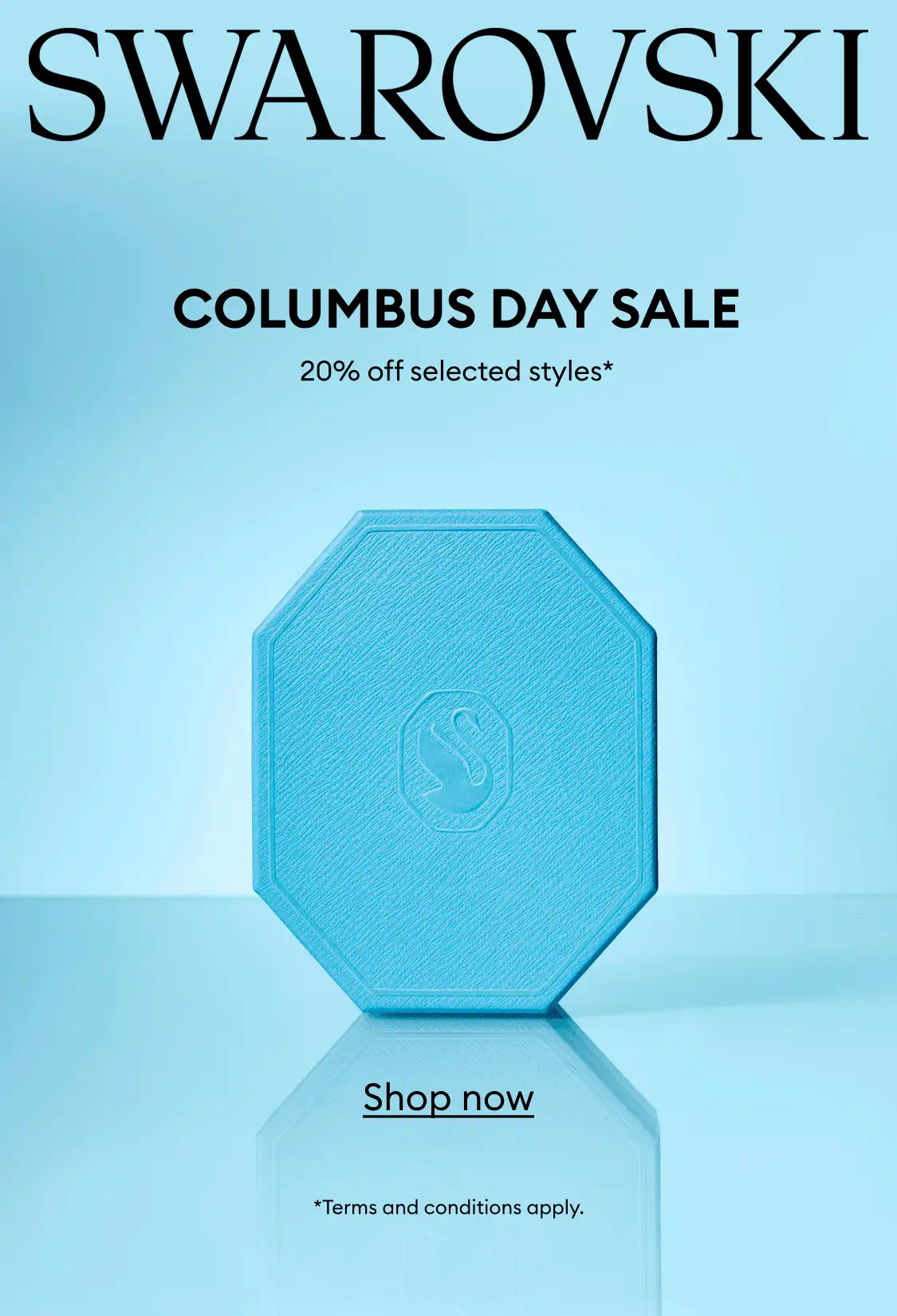 A blue Swarovski gift box on a blue background. Text reads: SWAROVSKI COLUMBUS DAY SALE 20% off select styles*