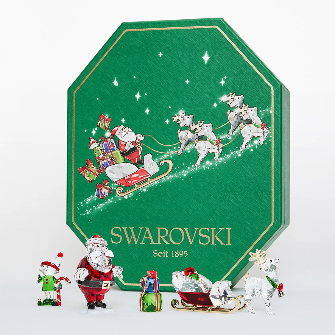 Swarovski Holiday character figurine set with green gift box