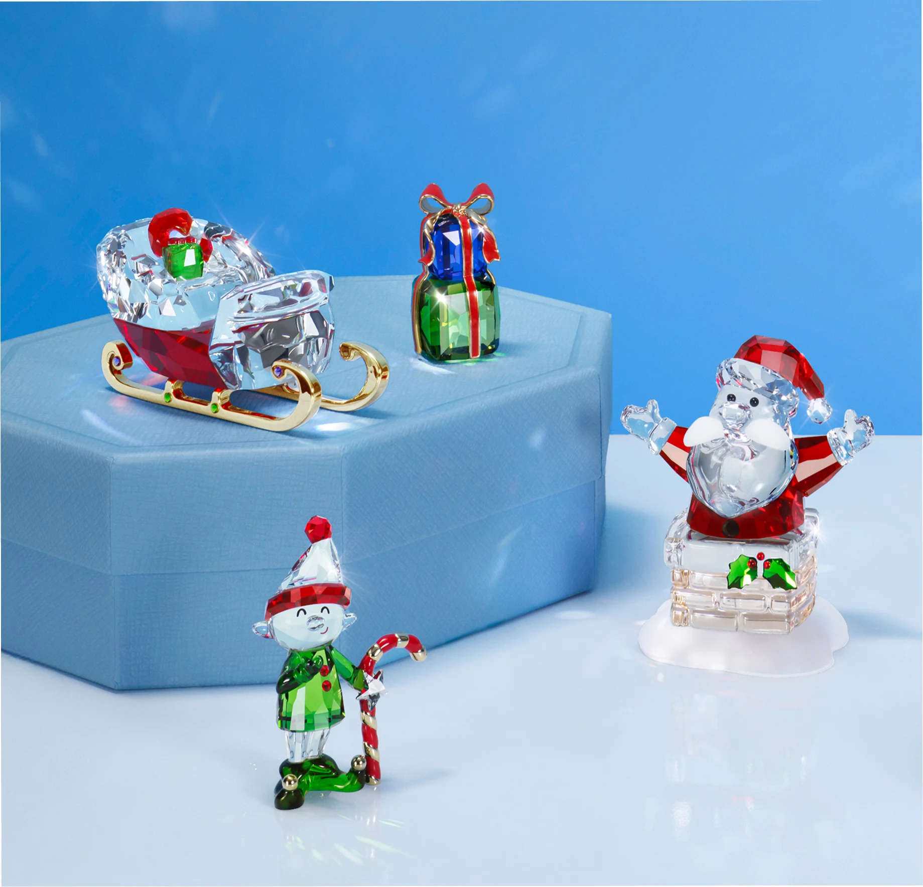 Holiday Cheers Figurines on a Swarovski Gift Box