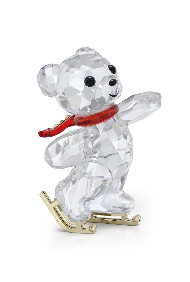 Kris Bear wearing a red scarf ice skating