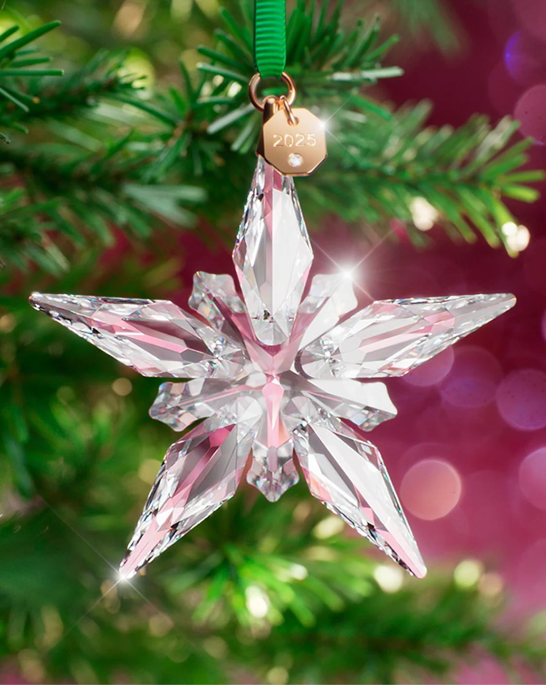 Swarovski Crystal ornament hanging on a Christmas tree