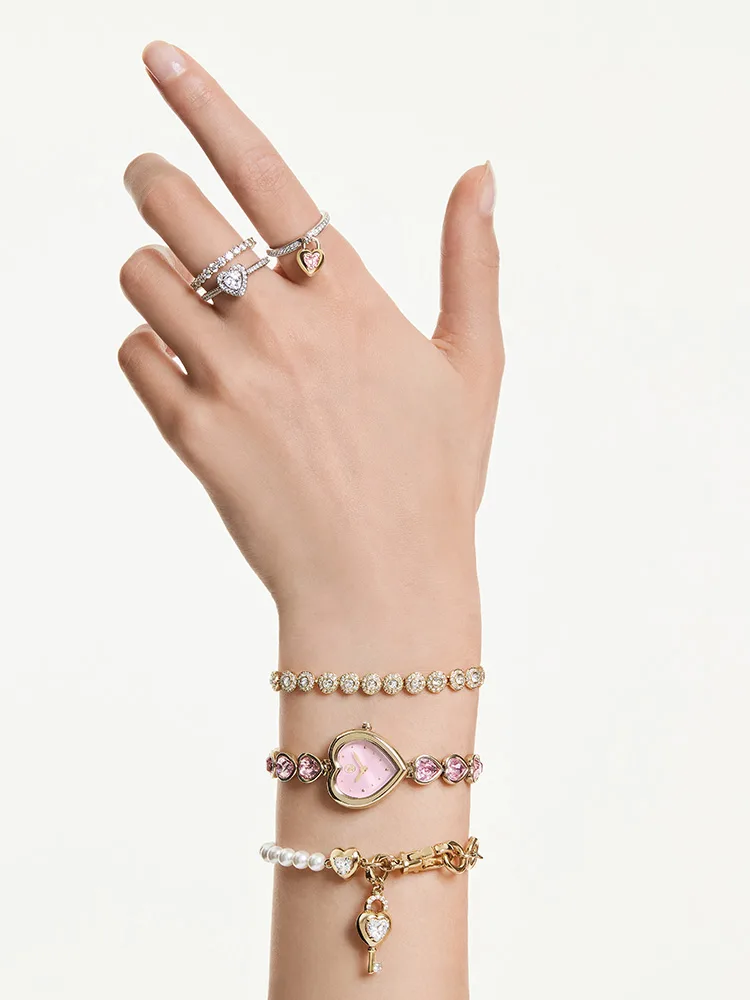 Model wearing pink heart-shaped watch