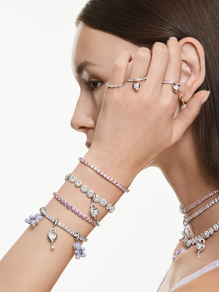 Model wearing charm bracelets