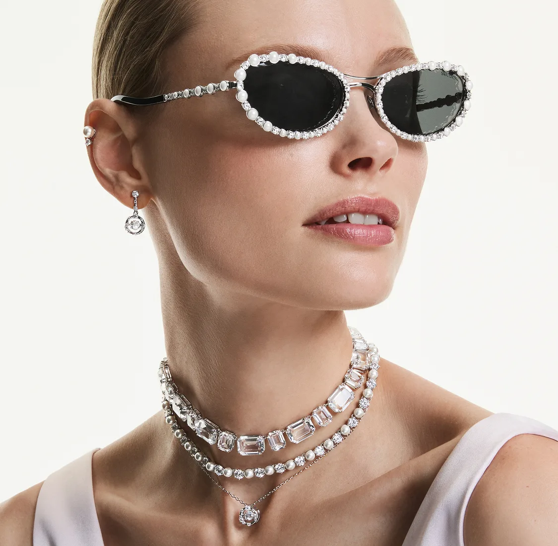 Model wearing Swarovski Millenia, Matrix and Constella jewelry and sunglasses