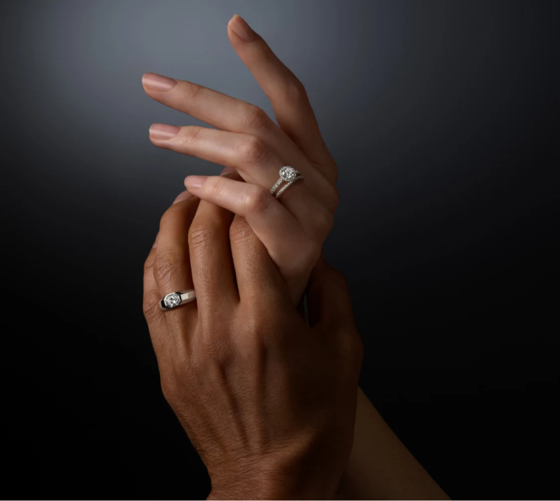Two hands wearing Swarovski Created Diamonds rings
