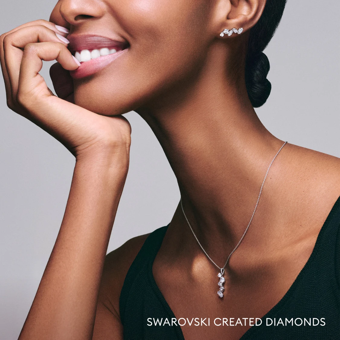 Model wearing Galaxy necklace and earrings