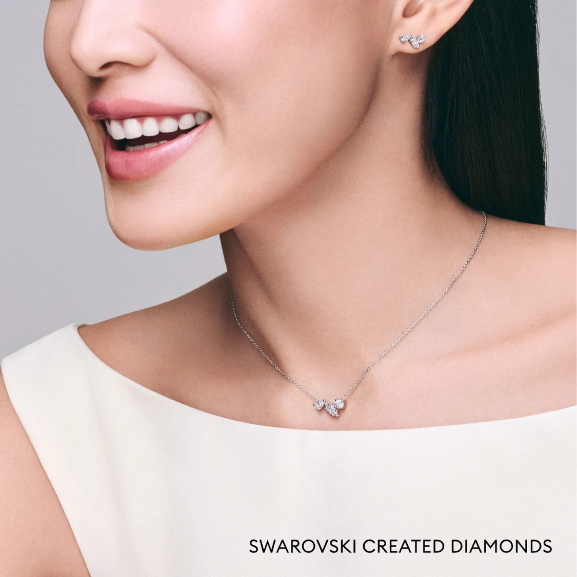 Model wearing Galaxy necklace and earrings