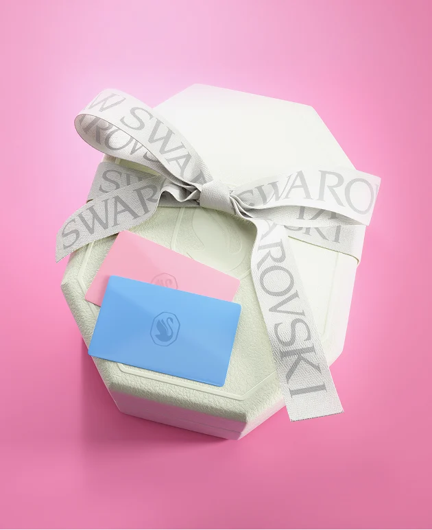 Swarovski gift cards sitting on a gift box