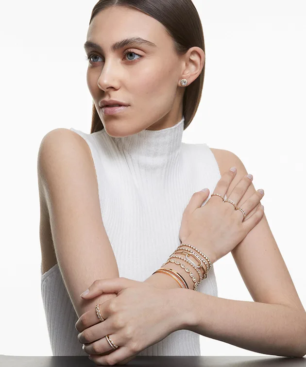 Model wearing gold-toned Una Angelic jewelry