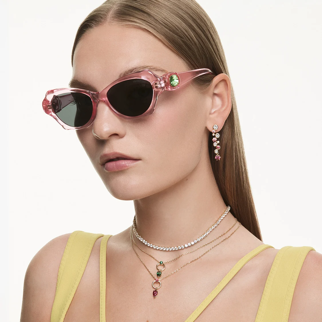 Model wearing Swarovski sunglasses and jewelry