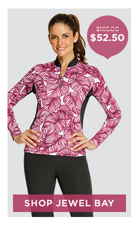 Model in long sleeve golf top with black piping and black golf bottoms