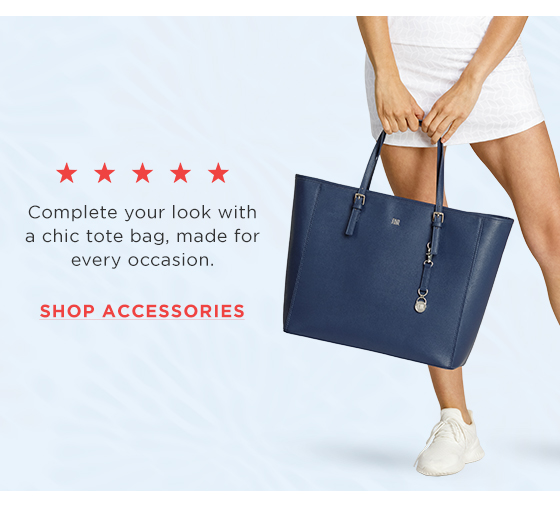Model carrying navy blue tote bag
