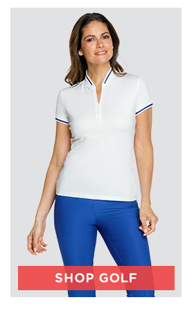 Model in white golf top with blue piping and blue golf bottoms