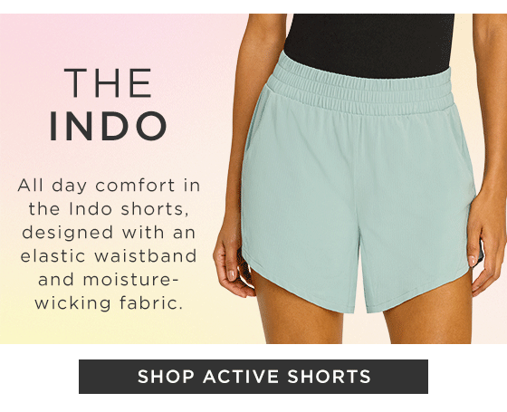 Model in green active shorts with side pockets 