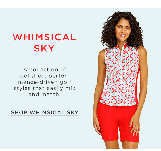 Model in golf top with geometric pattern and red golf shorts with side pockets 