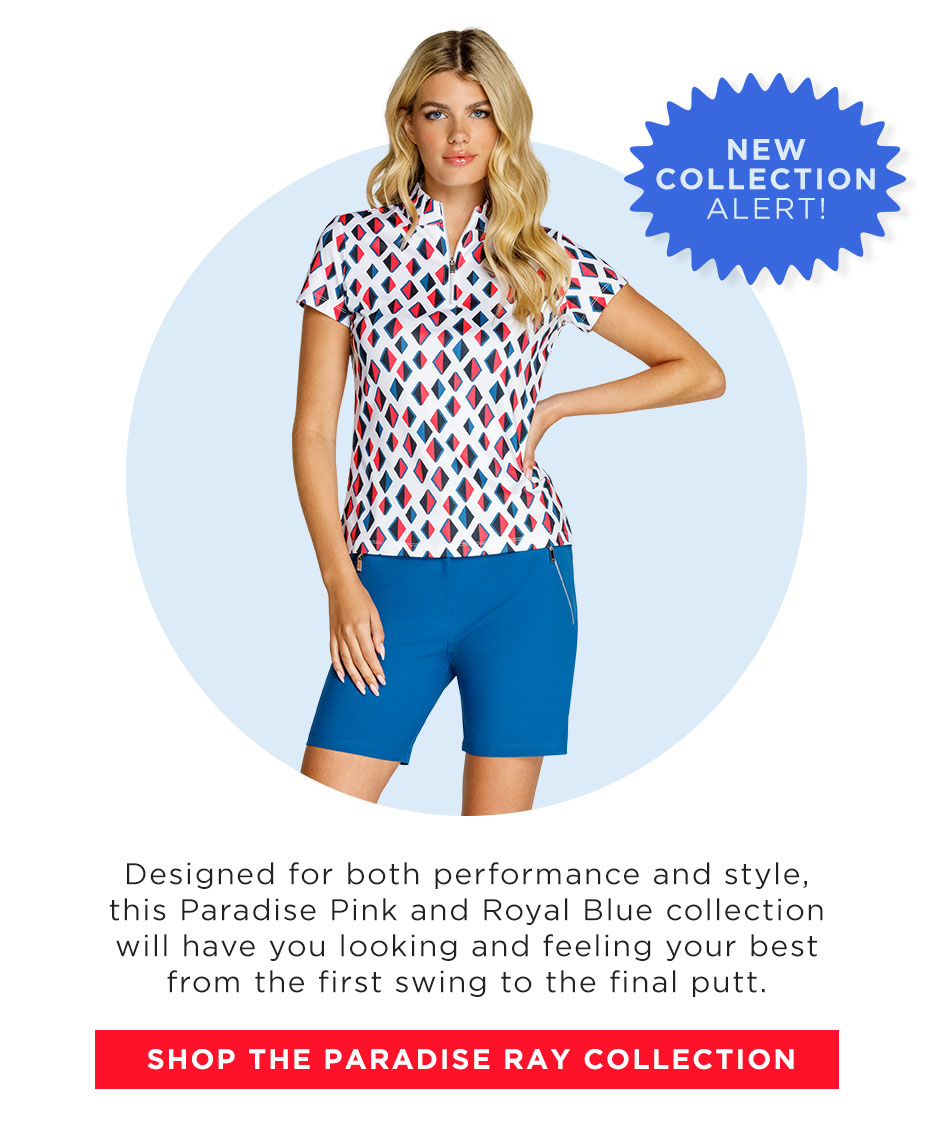 Woman in red, white, and blue geometric short sleeve top and blue shorts with zipper pockets