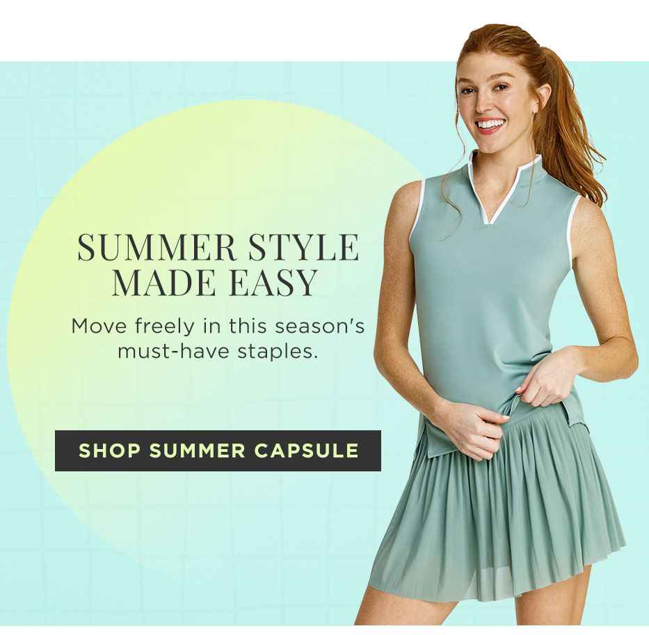 Woman in sage green sleeveless top with white piping and matching sage green pleated skort