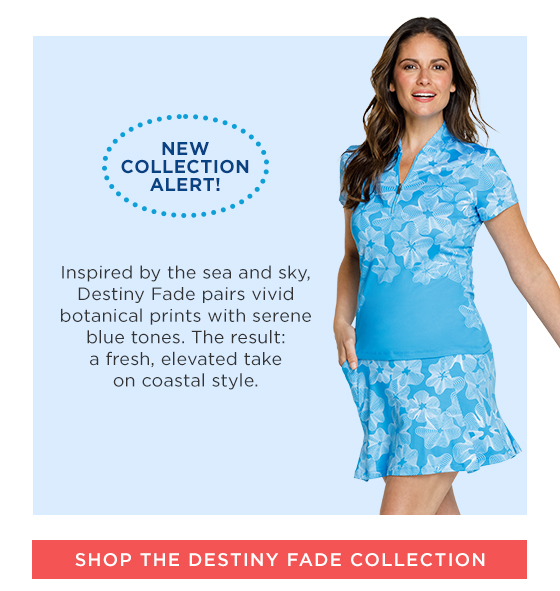 Woman in blue short sleeve top with white floral detail and matching skort