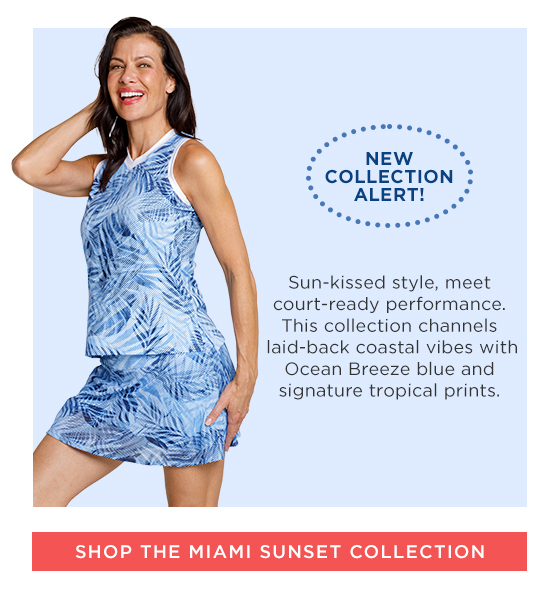 Woman in blue palm print tank top with white trim and matching blue palm print skort