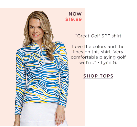Woman in white, blue, and yellow zebra print long sleeve top