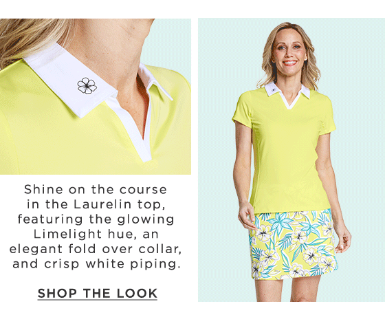 Woman in yellow short sleeve golf polo with white collar and yellow and turquoise floral print skort
