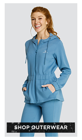 Woman in blue full zip jacket with hood and matching joggers
