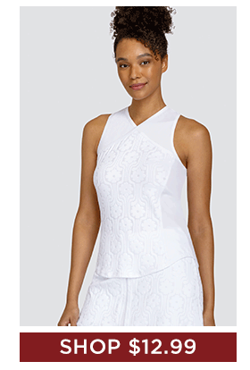 Woman in white tank top with tonal print and matching skort