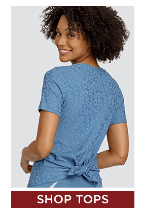 Blue short sleeve top with tonal animal print and back tie detail