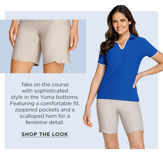 Woman in a blue short sleeve polo shirt and taupe shorts with scalloped hem