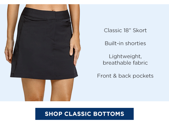 Woman in black skort with zip fly and pockets