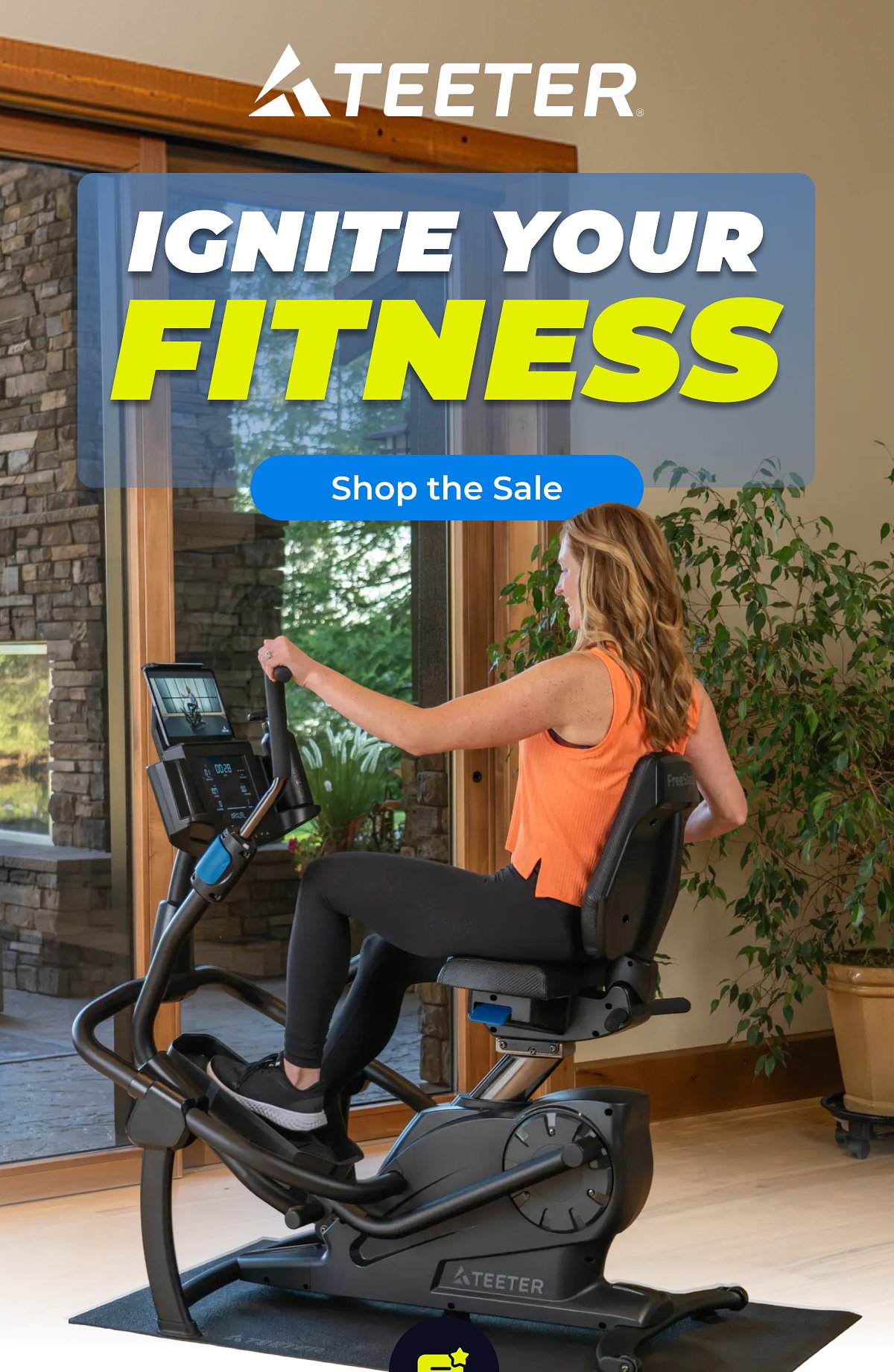 A woman exercising on a Teeter fitness machine in a bright room.