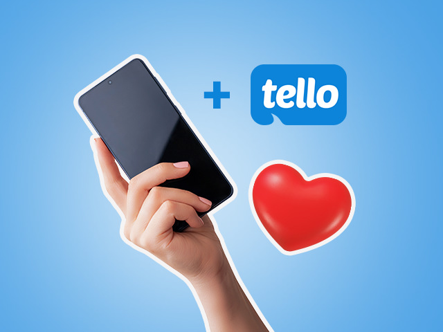 A hand holding a phone and a heart emoji