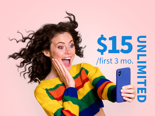 A lady looking surprised while looking at her phone