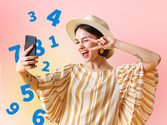 A woman taking a selfie with her phone