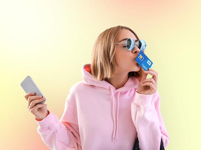 A woman taking a selfie with her phone