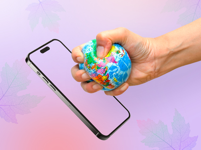 A picture of a phone and a hand holding a globe shaped ball