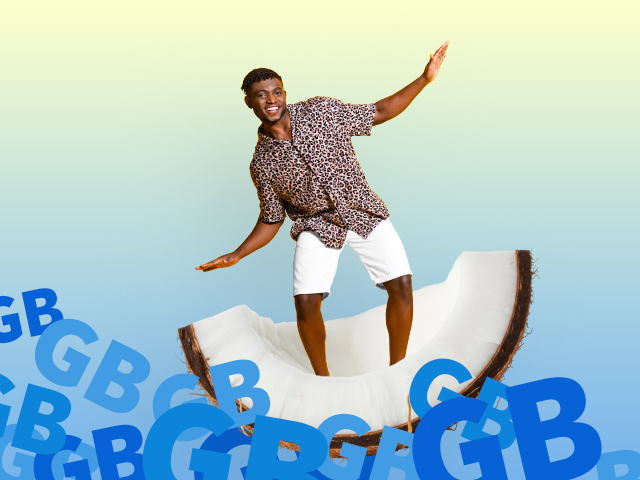 A man acting like he is surfing on a coconut