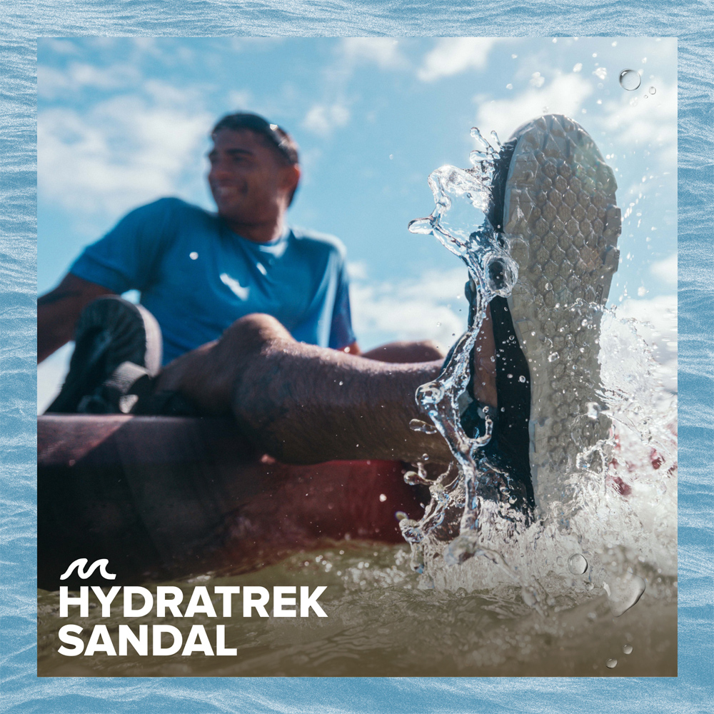 Man on the water in sandals.