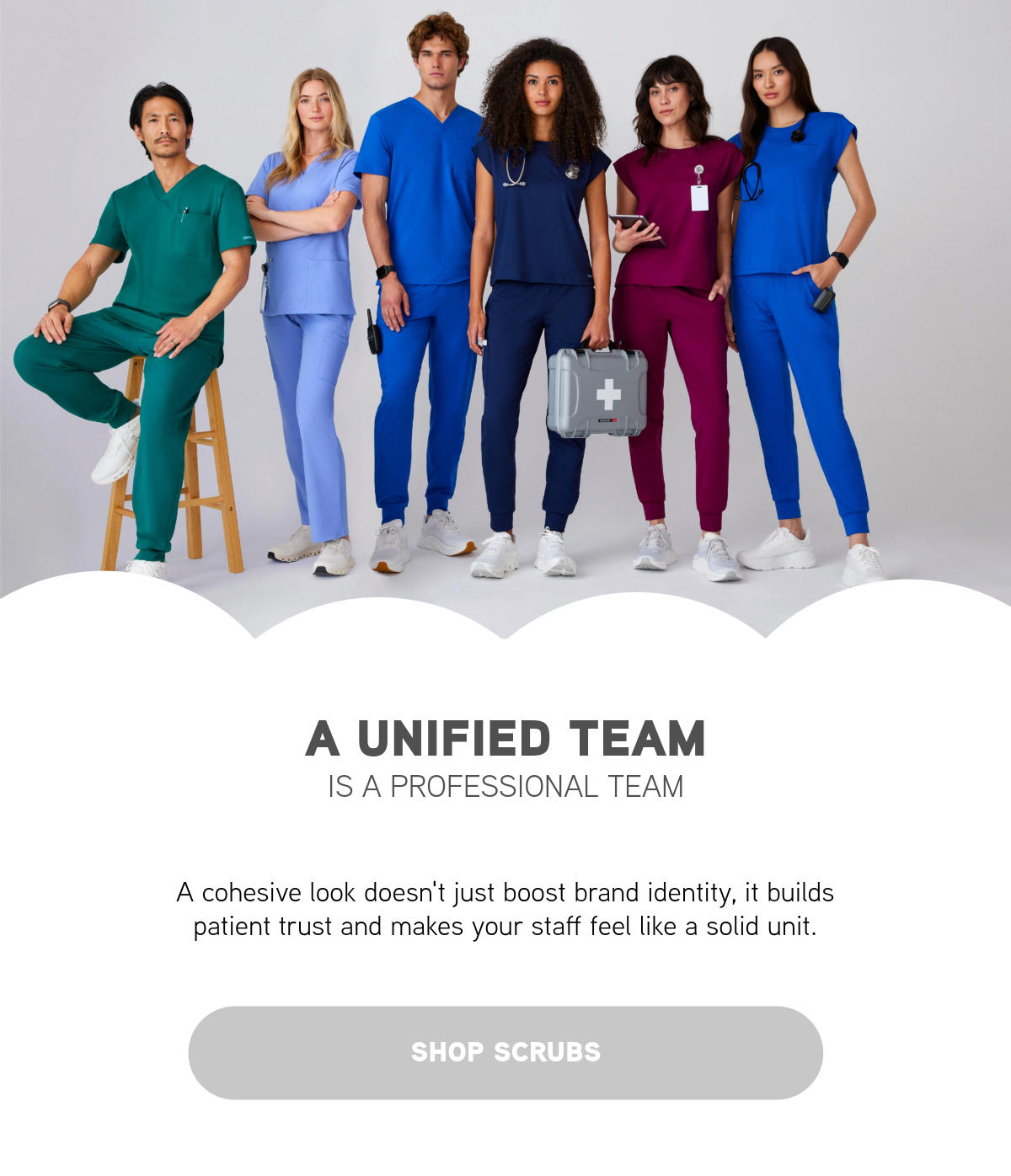 Group of nurses wearing different colors of scrubs.