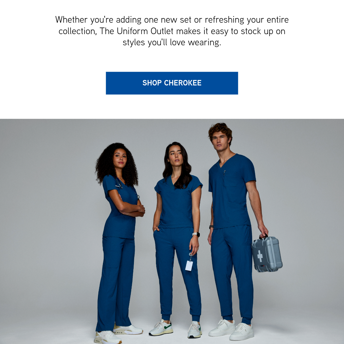 a man and two women in Cherokee scrubs standing next to each other. 