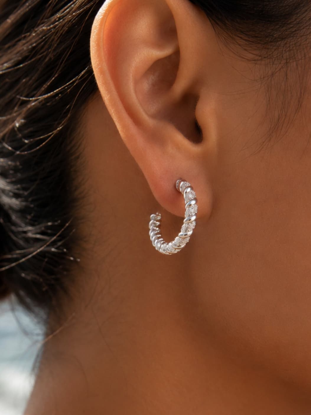 Beauty shot on model of Sunlit Twist Hoop Earrings