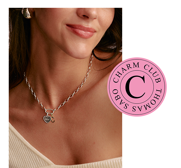 Close-up of a woman wearing a Charm Necklace with two Charms Connect