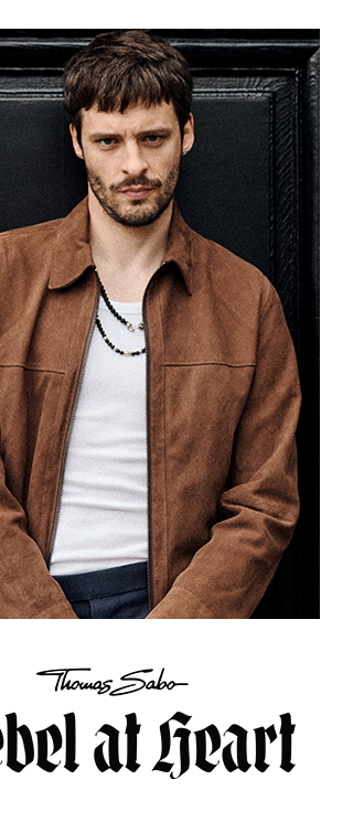 Silver necklace with black obsidian beads worn by a male model