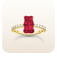 Gold-plated ring with red mini sized goldbears and zirconia