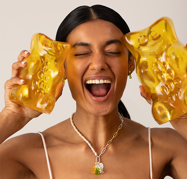 Model wearing several Haribo jewelry pieces