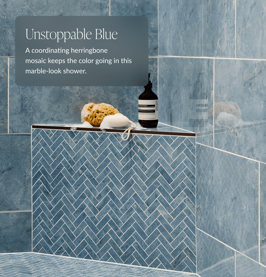 Unstoppable Blue - A coordinating herringbone mosaic keeps the color going in this marble-look shower. 